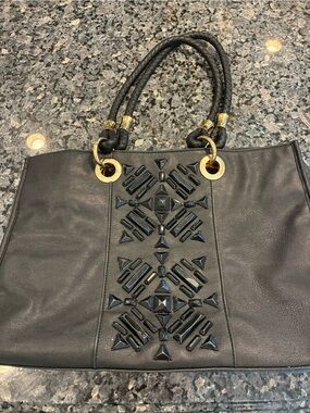 IMAN Black Studded Tote with Braided Handles and Gold Accents